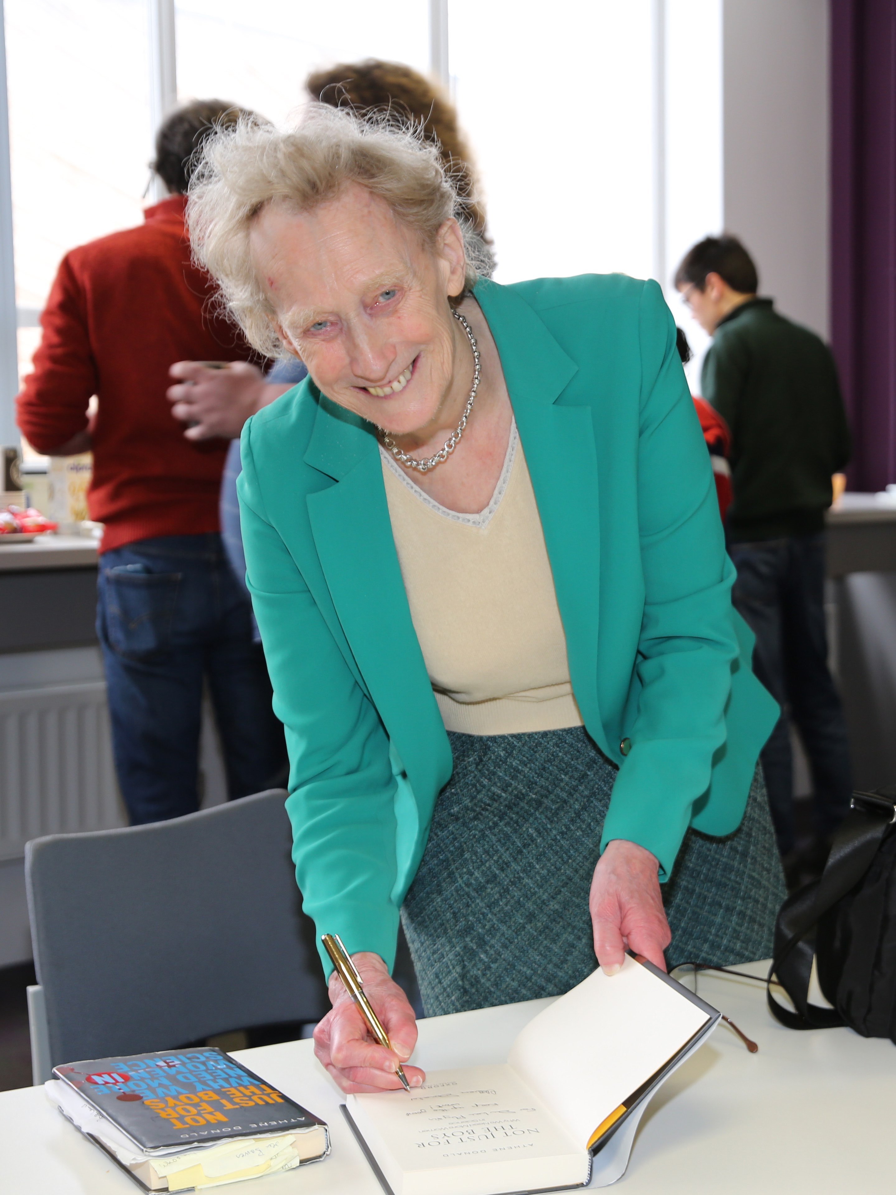 Dame Athene Donald signing a book